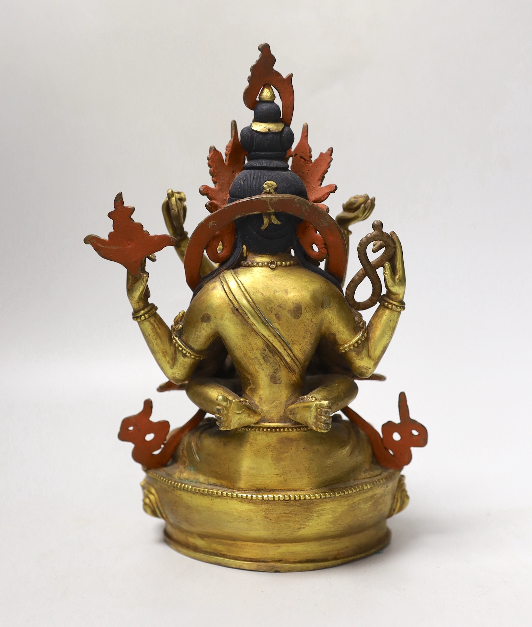 A Sino-Tibetan gilt bronze Buddha and consort, 23cm